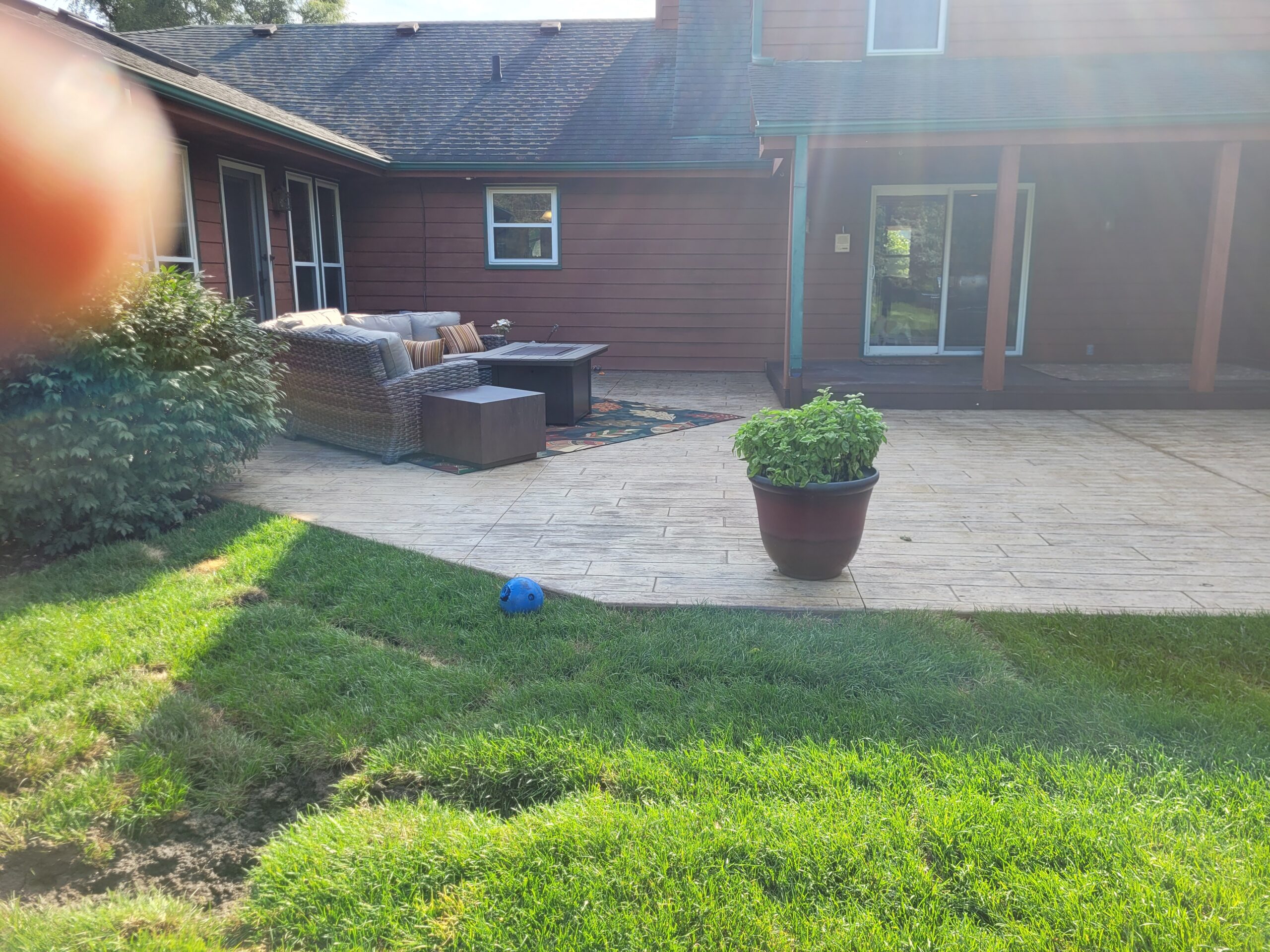 a lookat a stamped concrete patio installed by Imagepros with Woodplank pattern